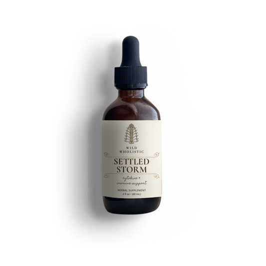Bottle of Settled Storm supplement with dropper on a white background