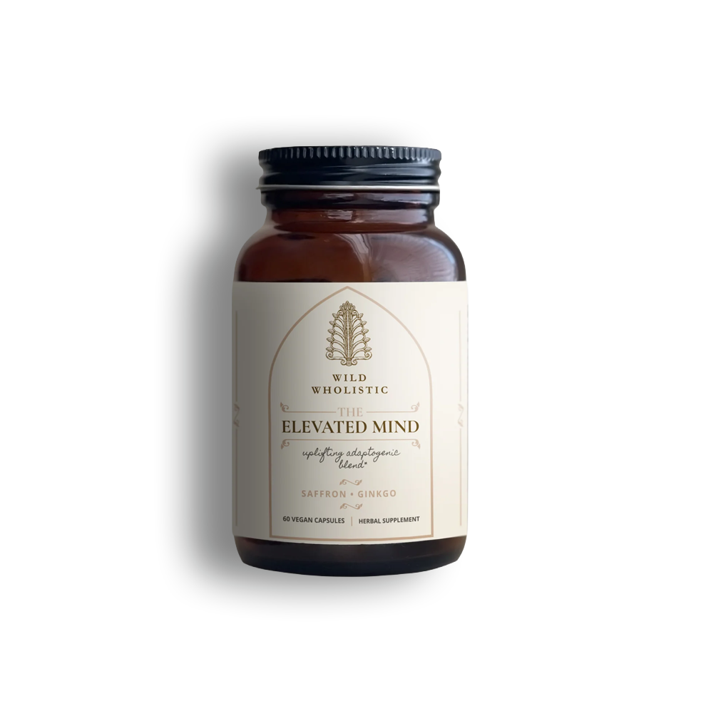 Supplement bottle 'Elevated Mind,' an uplifting adaptogenic blend by Wild Wholistic.